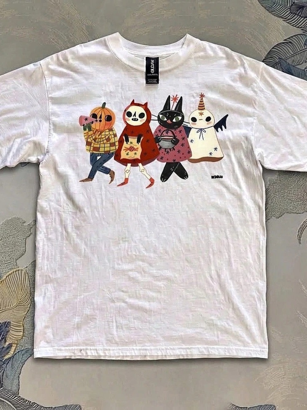 White T-shirt featuring cute Halloween characters